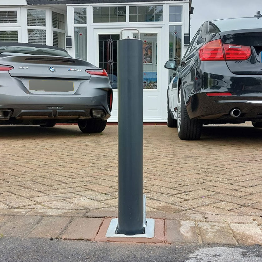 lockable telescopic bollard installed on a driveway