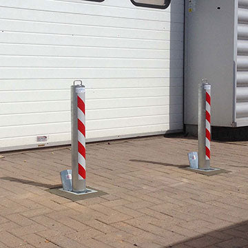 Heavy duty telescopic bollards protecting roller shutters