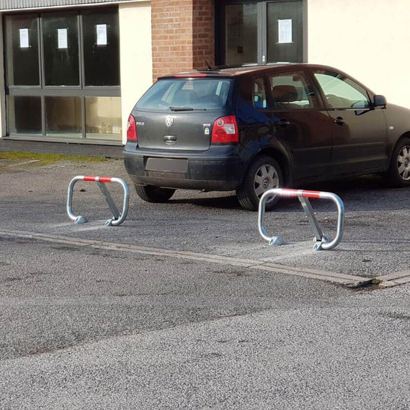 City fold down parking barriers in a galvanised finish.