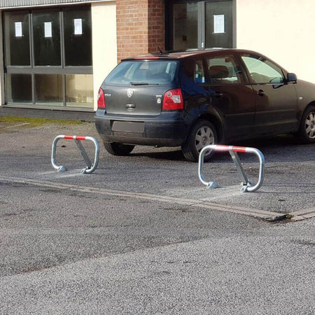 City fold down parking barriers in a galvanised finish.
