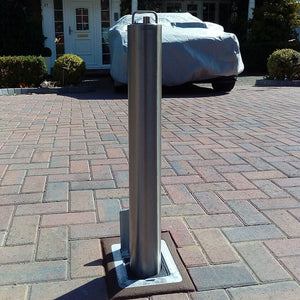 SS14 Stainless steel heavy duty telescopic bollard on a block paved driveway