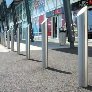 Mitre top stainless steel bollards on a retail park