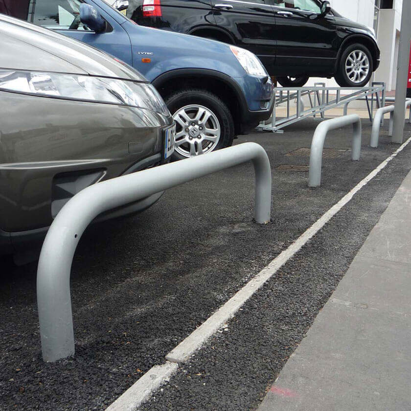 Fixed steel hoop barriers installed on a vehicle forecourt