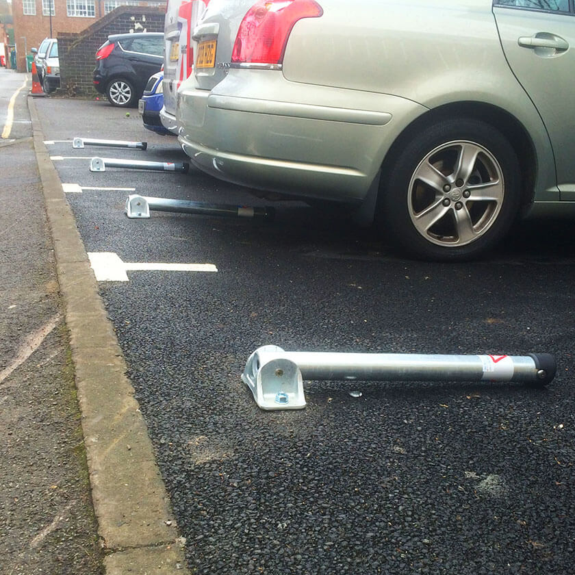 Fold down parking posts in a row of 4 posts