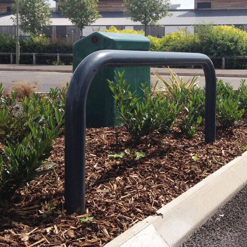 Steel hoop barrier installed in a flower bed