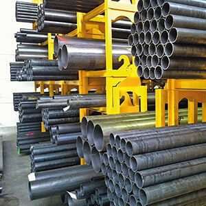 Steel bollards before manufacture in a warehouse