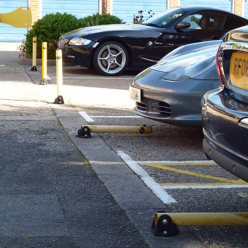 Fold down parking posts installed to protect private parking spaces