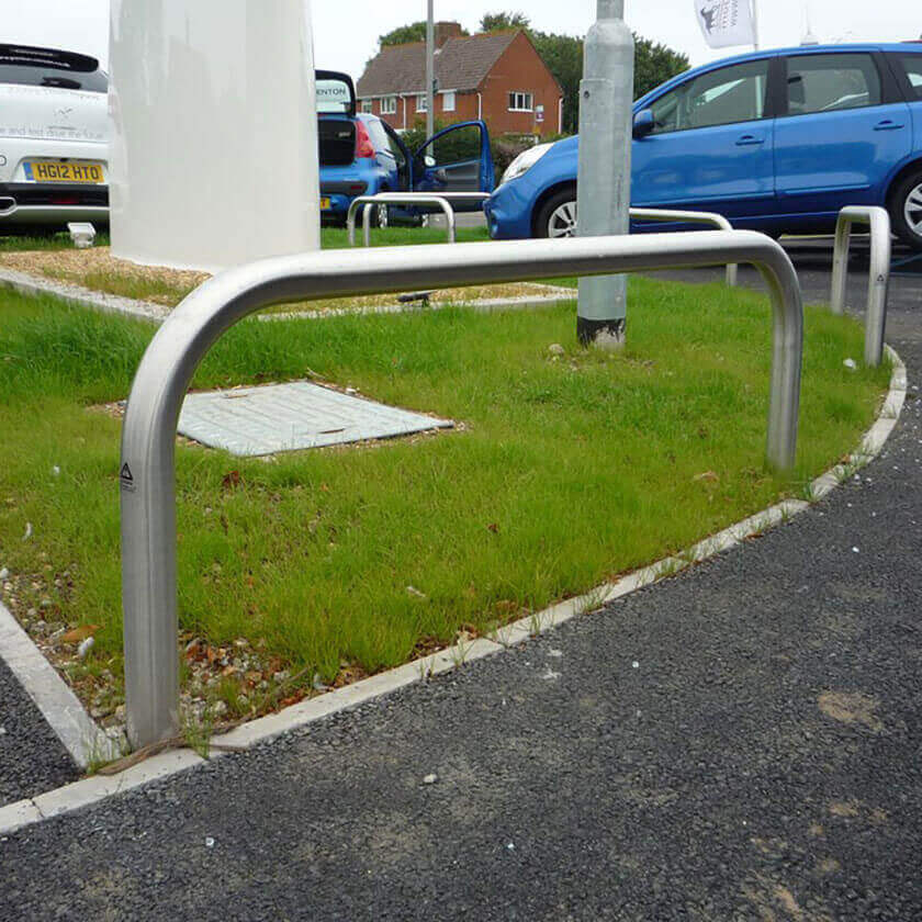 Stainless steel hoop barriers installed on a vehicle forecourt