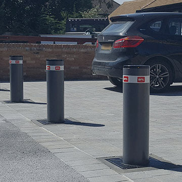Automatic rising bollards installed across the entrance to a driveway