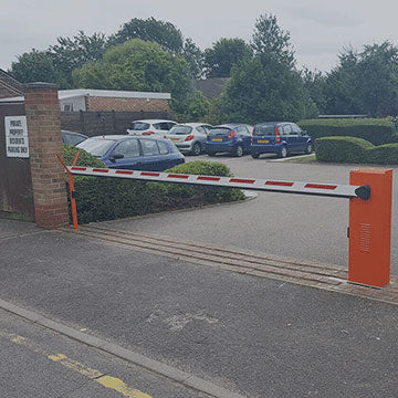 Automatic arm barrier installed across the entrance to a car park