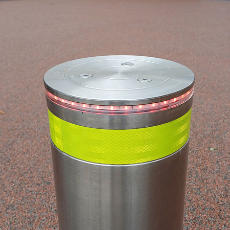 Stainless steel automatic rising bollard  with a Yellow reflective and LED light crown