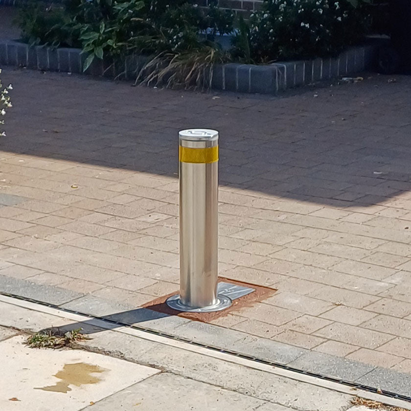 Stainless steel automatic wireless bollard on a driveway