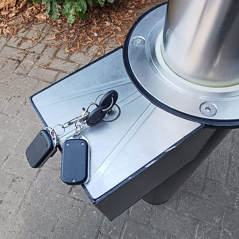 Battery enclosure with key inserted into the lock