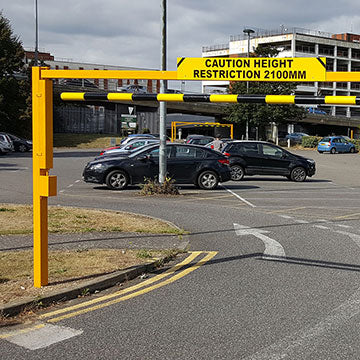 Height restriction barrier protecting a private car park