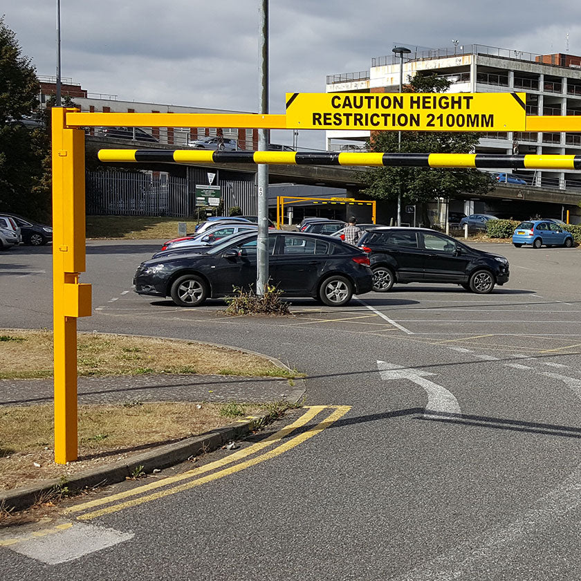 Height restriction barrier protecting the entrance to a private car park
