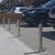 Retractable stainless steel security bollards installed on a driveway