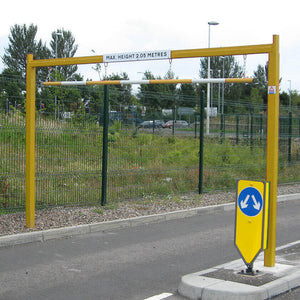 Fixed height restriction barrier in a Yellow powder coated finish.