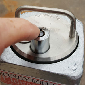 Push button top lock