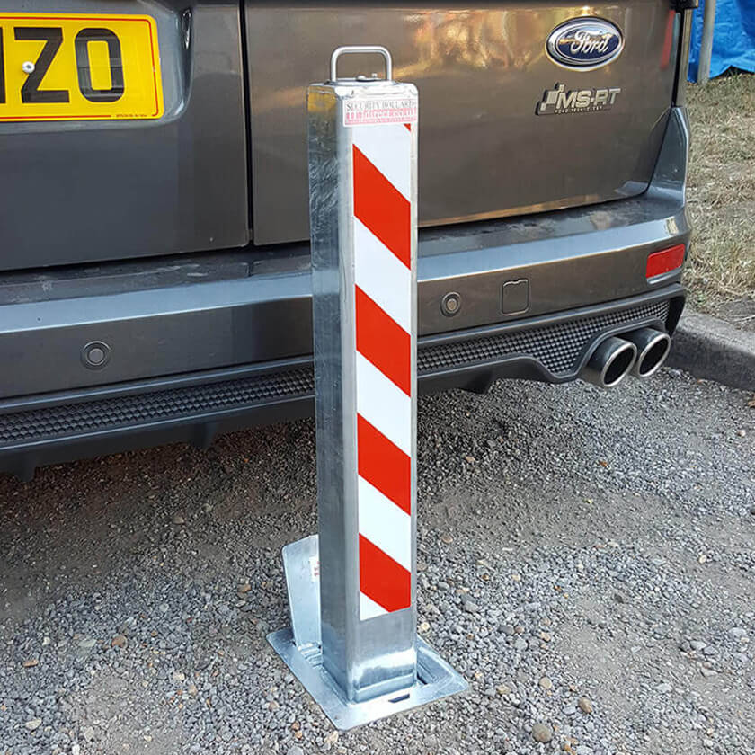 SQ8 anti ram raid telescopic security bollard protecting a Ford Transit Connect MS-RT