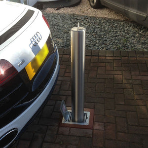 SS14 Stainless steel heavy duty telescopic bollard protecting a sports car