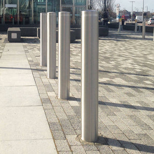 129mm diameter dome top stainless steel bollards on a retail park