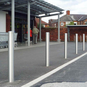 Dome top stainless steel bollards at a retail shopping centre