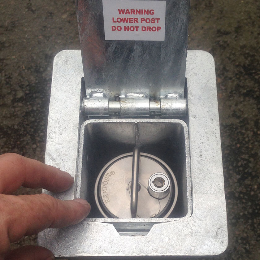 Bollard lowered into the ground socket