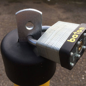 Large padlock inserted into the top of the post